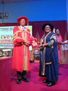 Vice Chancellor of Unical, Prof. Florence Obi (R), presenting a memento to Prof. Bassey B. Esu at the inaugural lecture.